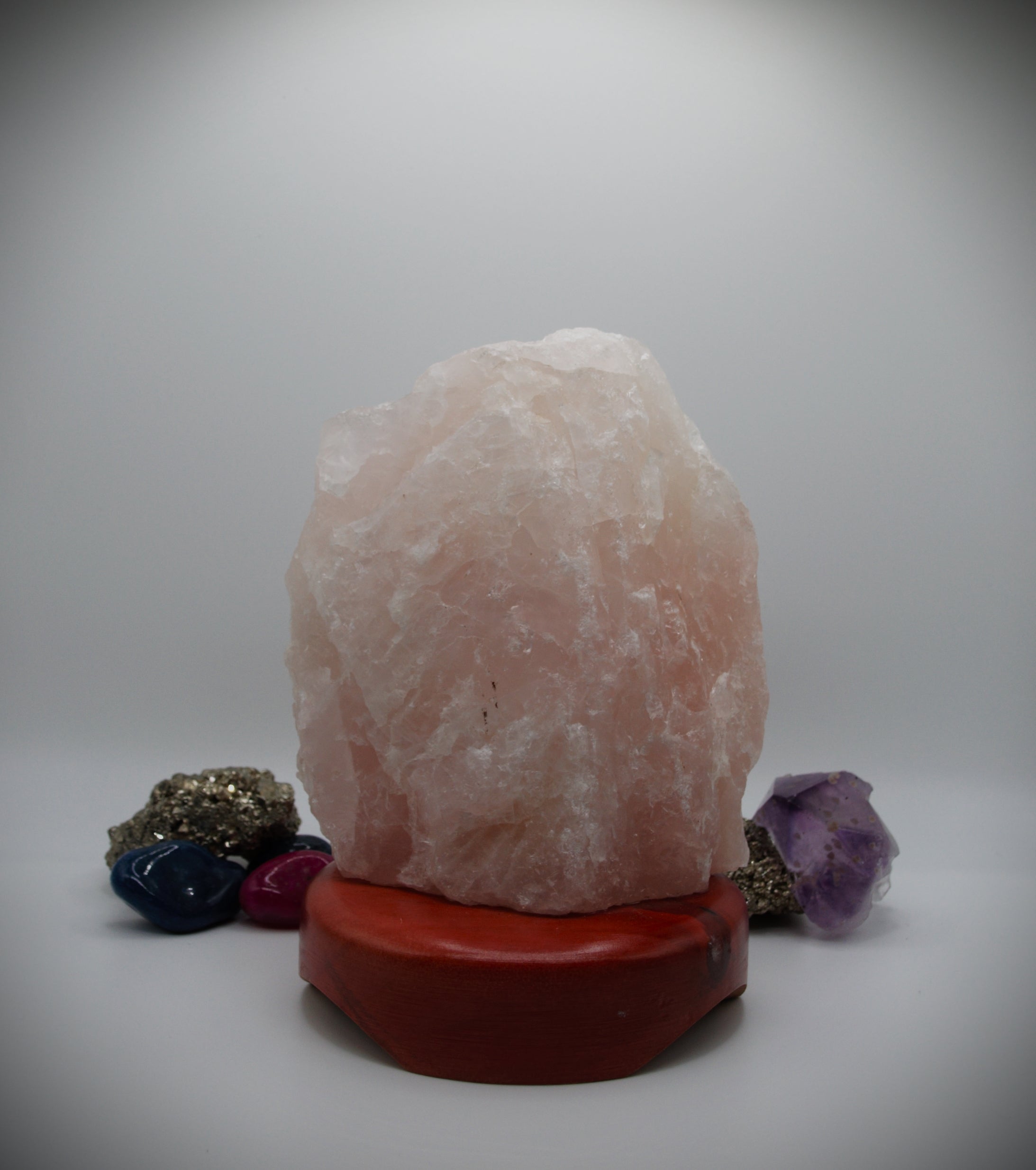 Rose Quartz Crystal Stone (with polished wooden base)